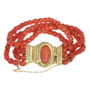 Antique four string coral bracelet with coral cameo in 18K gold closure